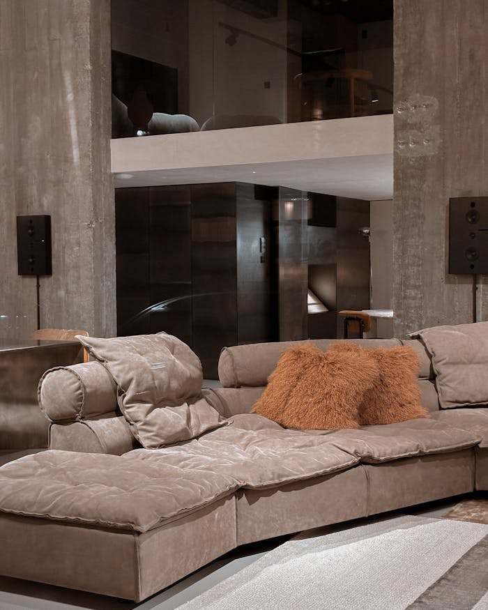 Stylish modern living room featuring a luxurious plush sofa and contemporary decor.